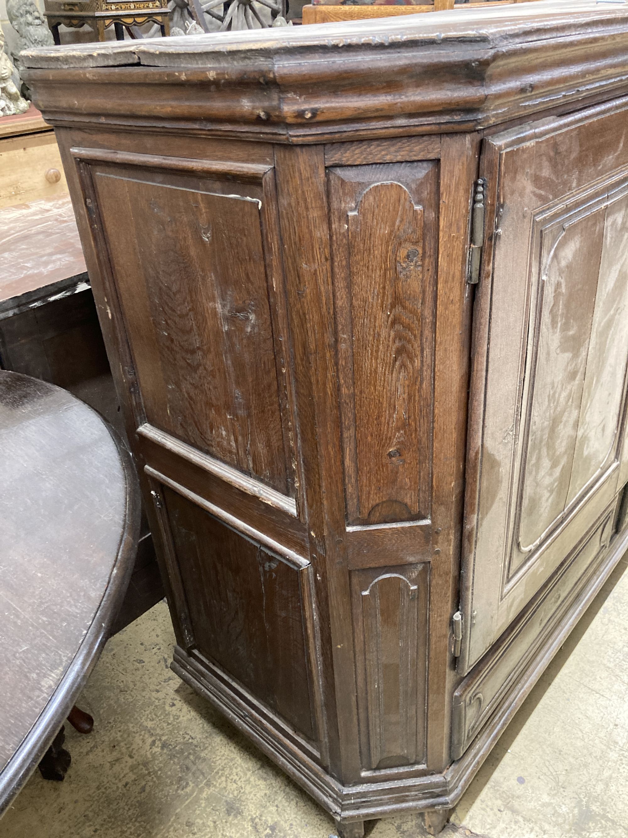 A Dutch oak two door cabinet, width 170cm, depth 60cm, height 124cm